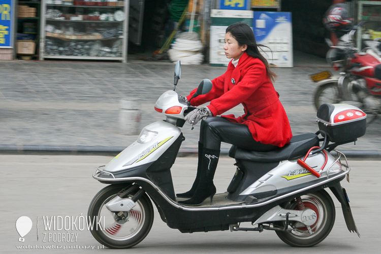 
Chick on a scooter. Beijing. China.